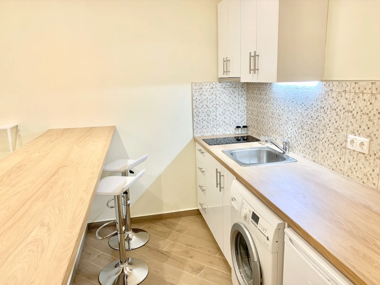 Kitchen with bar stools in an Athens rental apartment