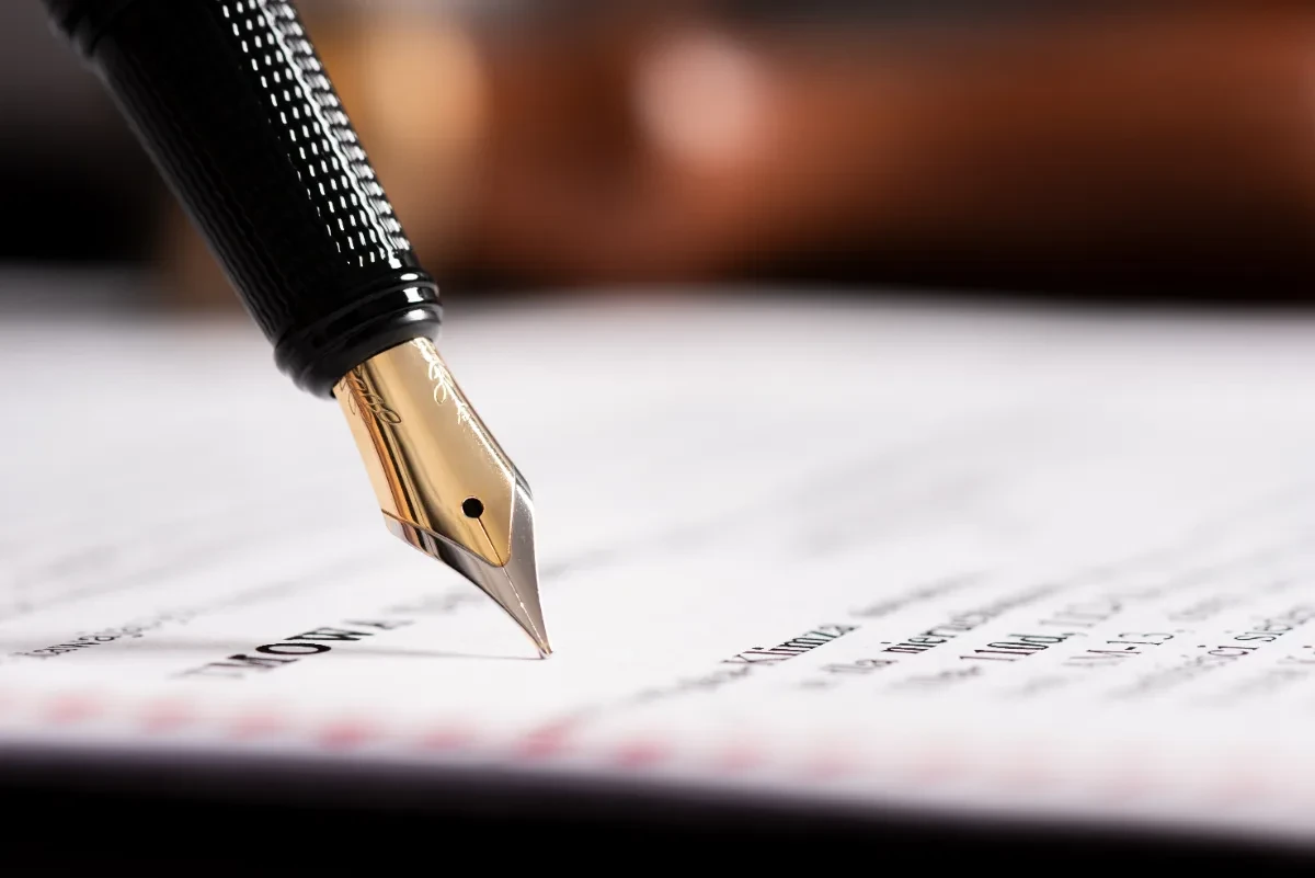 Signing the notarial deed at a Greek notary, where the property purchase is completed.